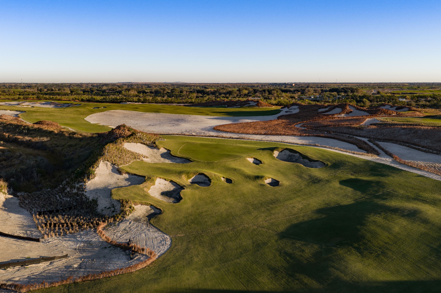 Sweeping Streamsong Resort fairway at golden hour